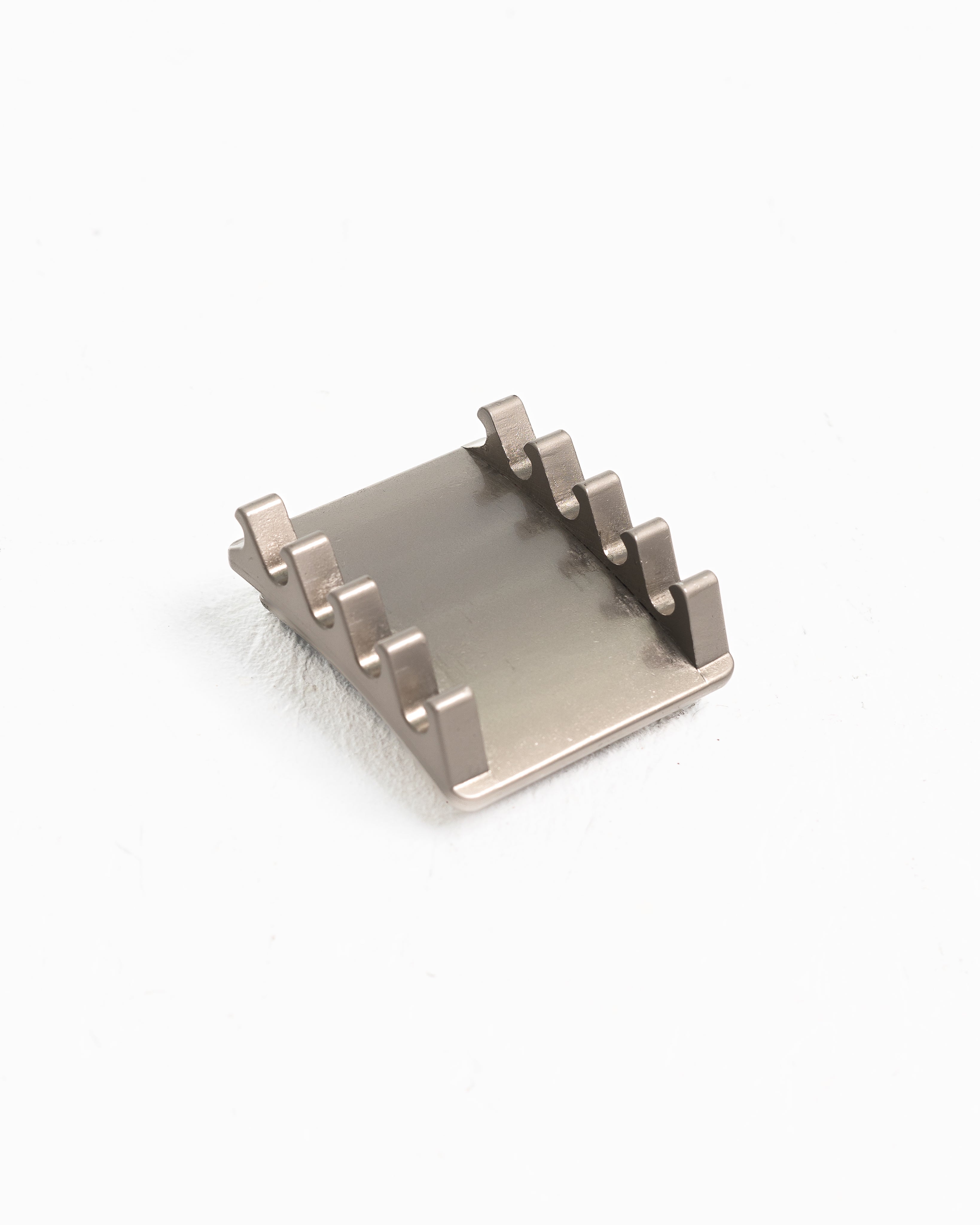 Close-up of the slotted adjustment rail on the silver PAL buckle for precise 0.5-inch tension control.
